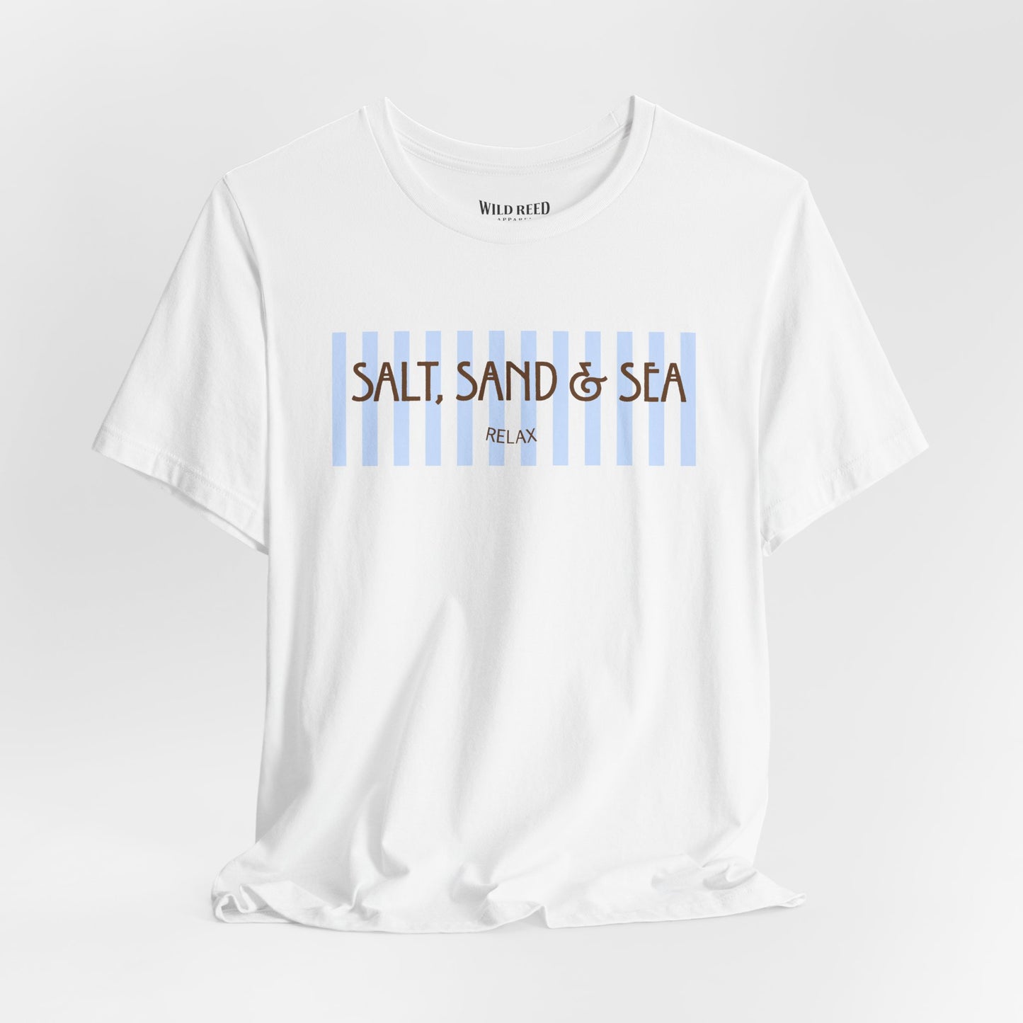 A white short-sleeve crewneck t-shirt with a graphic on the chest featuring light blue vertical stripes and brown text reading 'SALT, SAND & SEA' with 'RELAX' underneath. The brand 'WILD AID' is printed inside the collar.
