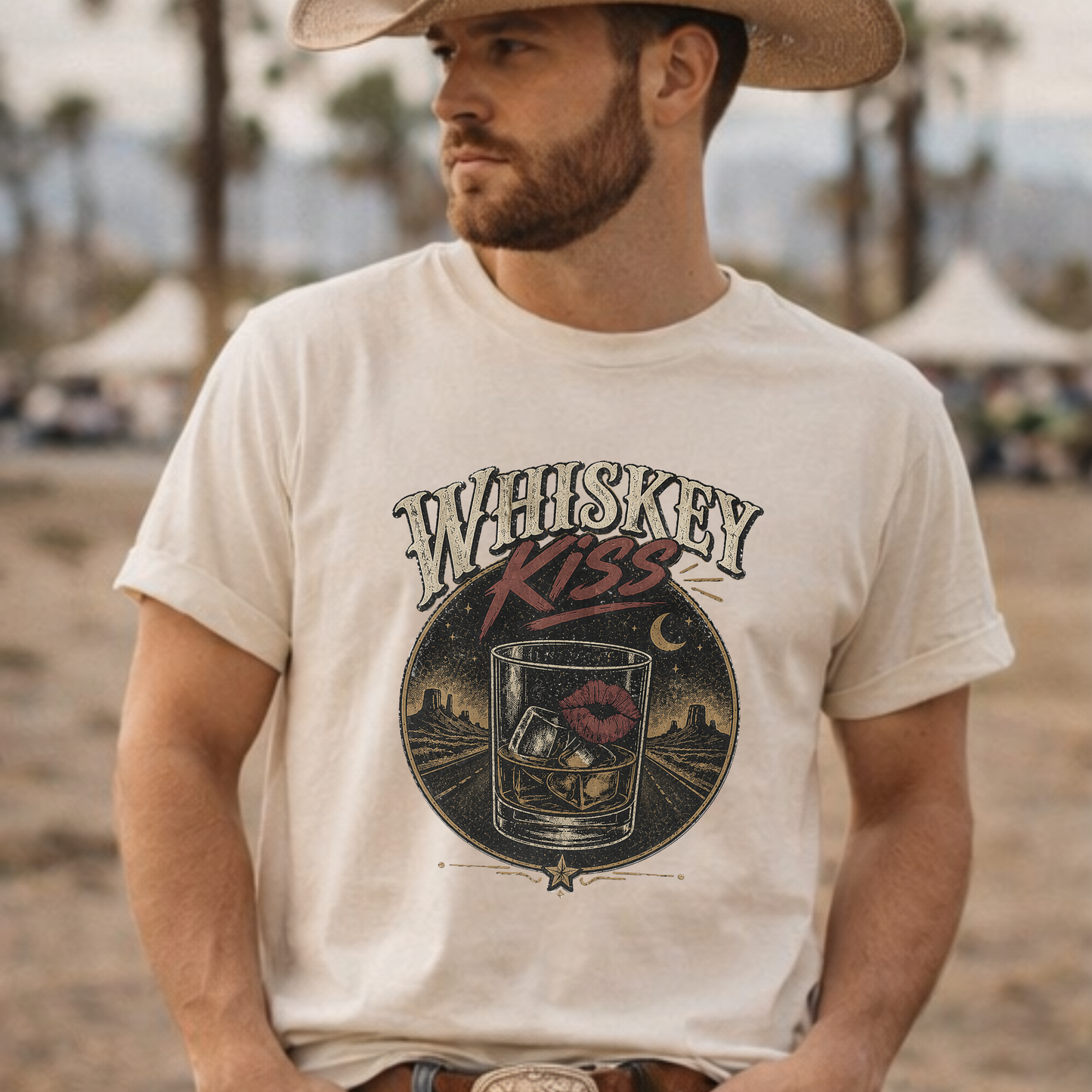 Man wearing Whiskey Kiss country graphic tee with cowboy hat