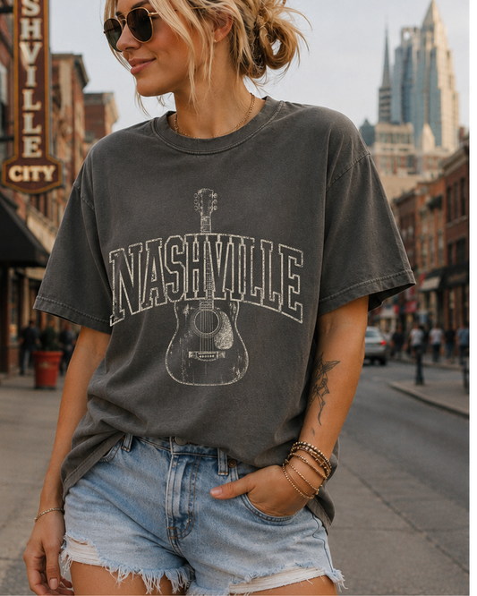 Vintage Nashville guitar graphic tee on pepper Comfort Colors shirt with distressed collegiate lettering and acoustic guitar design