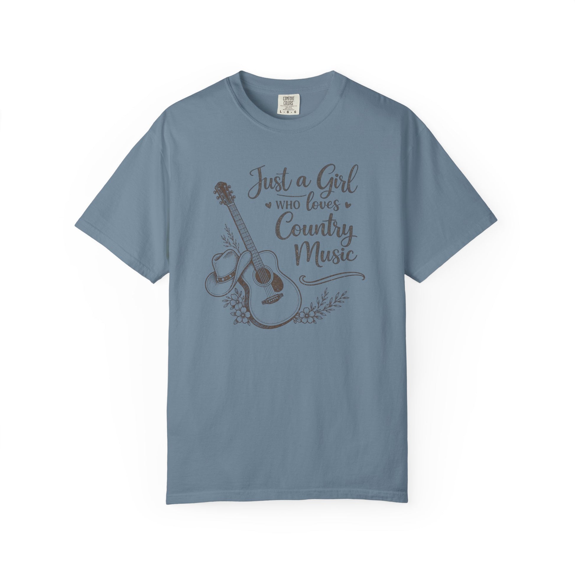 Blue t-shirt with a graphic of a guitar and text 'Just a Girl Who Loves Country Music' on a white background
