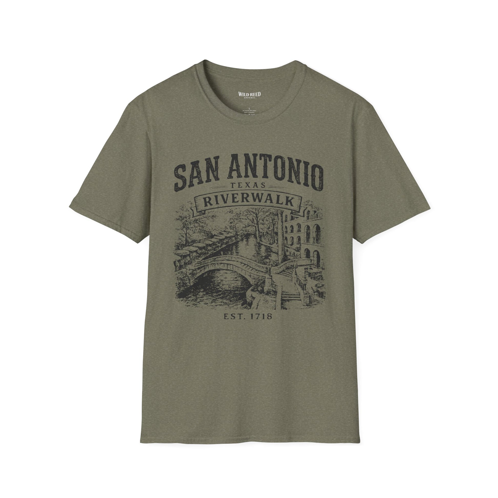 An olive green short-sleeve t-shirt with a dark gray graphic print on the front reading 'SAN ANTONIO RIVERWALK TEXAS EST. 1718' above an illustration of a river scene with a bridge.