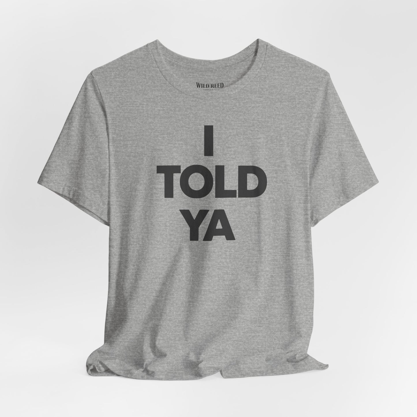 Athletic Heather Bella+Canvas 3001 featuring a bold I Told Ya minimalist typography design by Wild Reed Apparel.