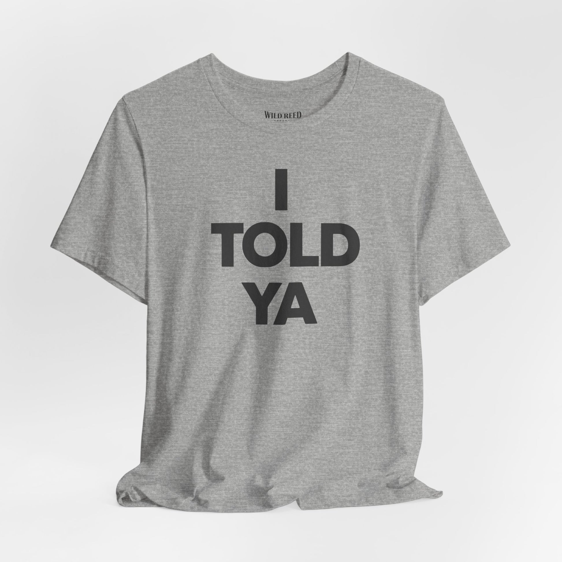 Athletic Heather Bella+Canvas 3001 featuring a bold I Told Ya minimalist typography design by Wild Reed Apparel.