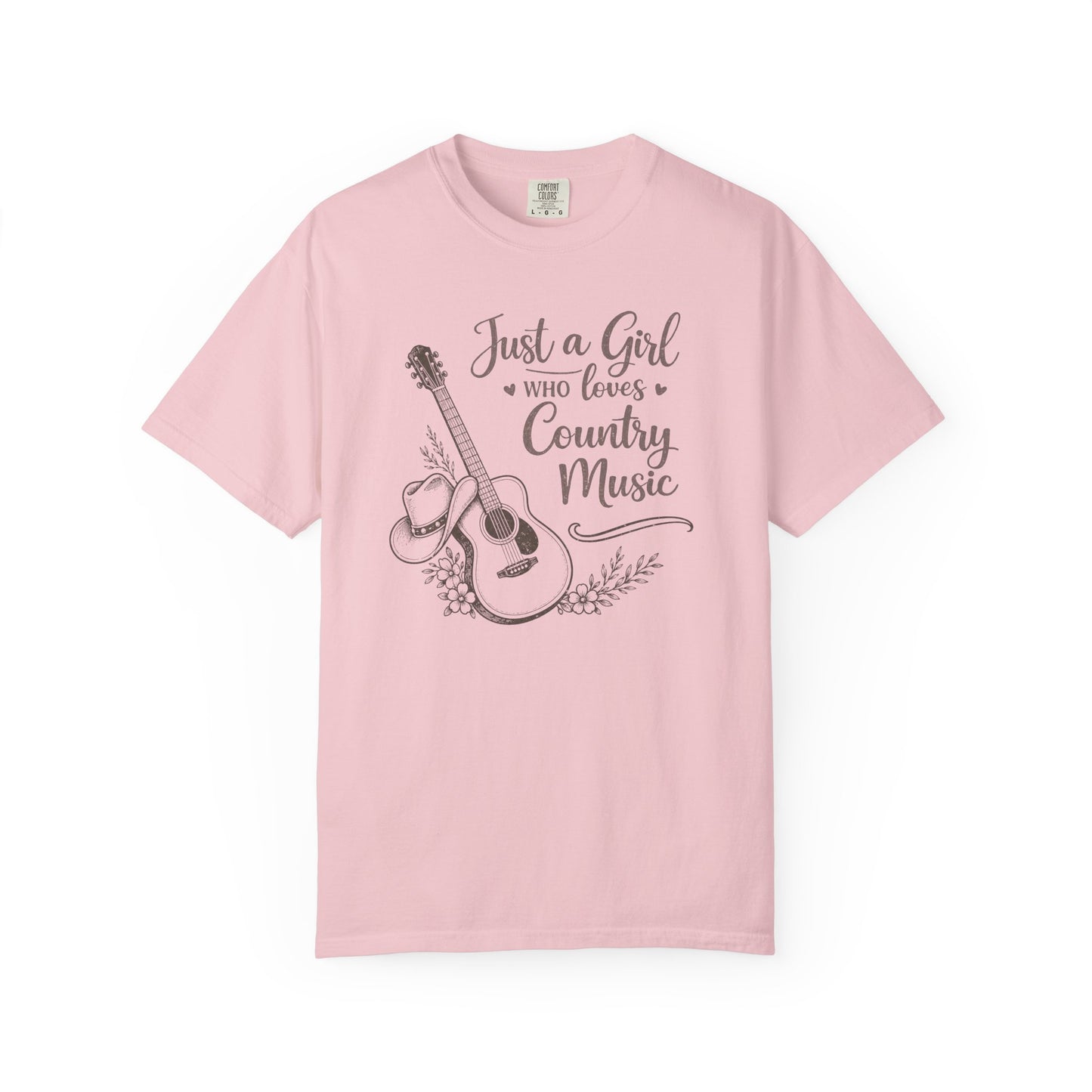 Pink t-shirt with a graphic of a guitar and text 'Just a Girl Who Loves Country Music' on a white background