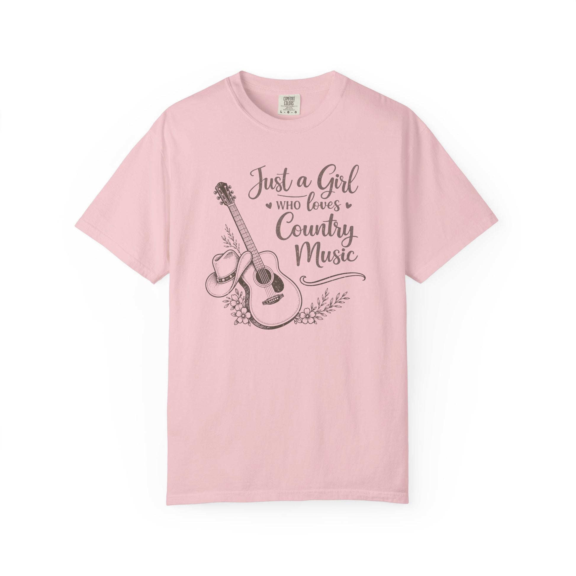 Pink t-shirt with a graphic of a guitar and text 'Just a Girl Who Loves Country Music' on a white background