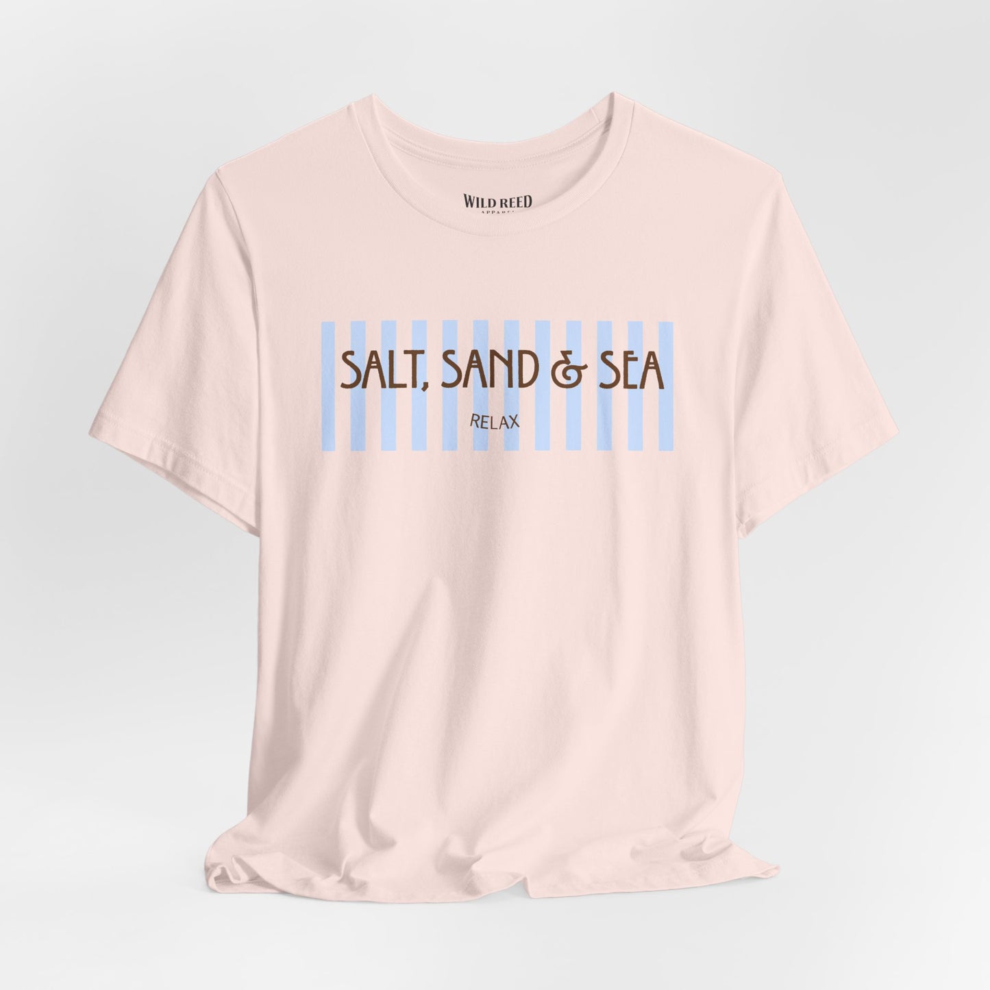 Light pink Salt, Sand & Sea beach graphic tee featuring light blue stripes and brown vintage-inspired lettering.