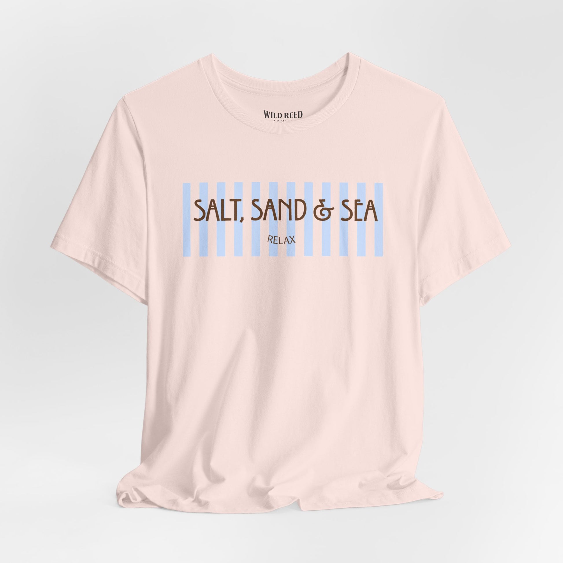 Light pink Salt, Sand & Sea beach graphic tee featuring light blue stripes and brown vintage-inspired lettering.